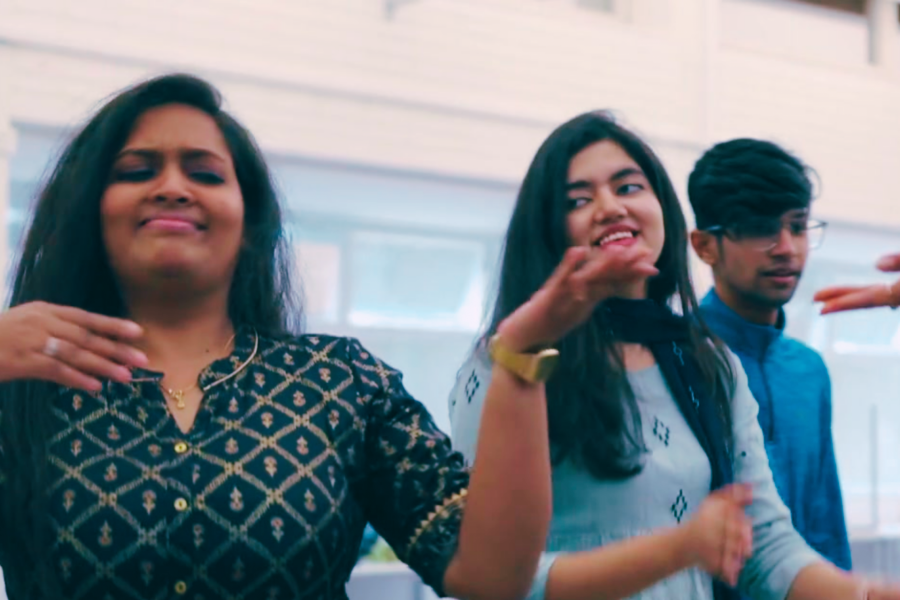 Indian Society members dancing at a social gatherings