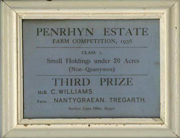 A framed certificate for third place in a 1936 Penrhyn Estate farm competition. 