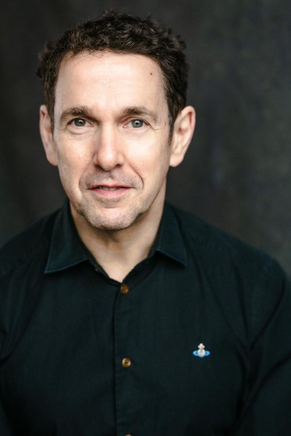 A headshot of Iwan Llewelyn Jones