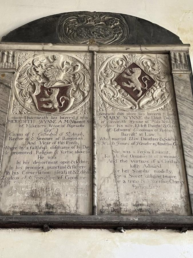 Photograph of a marble memorial hung on a wall