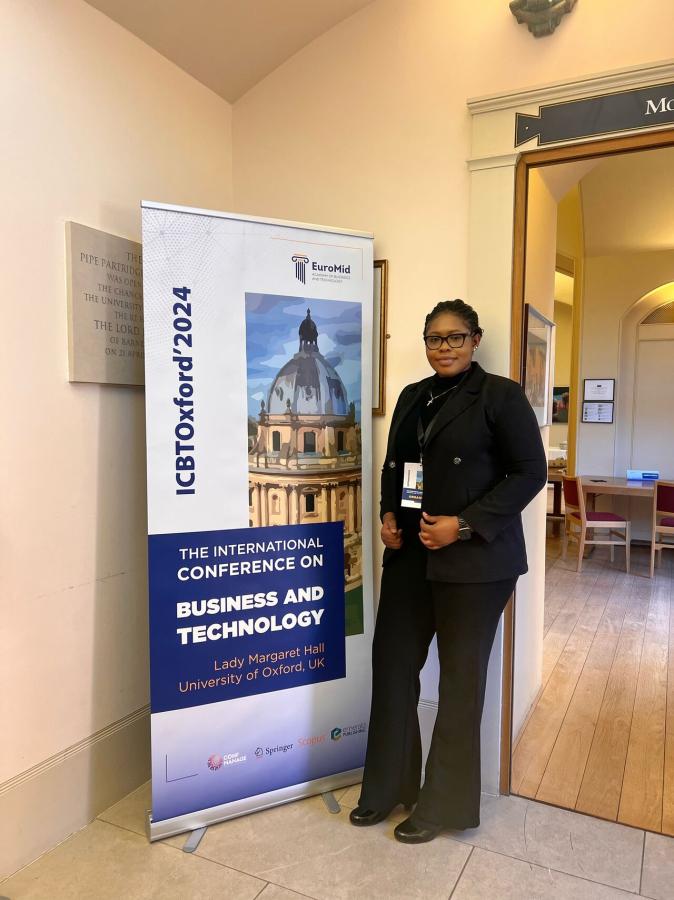 A picture of Esther Fiattor, BBS' doctoral researcher, participating at the International Conference of Business Technology