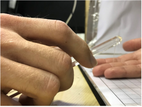 Researcher using probe to investigate touch localisation