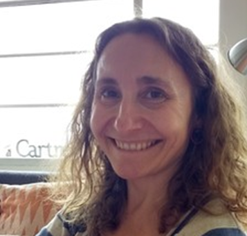 A woman smiling for the camera