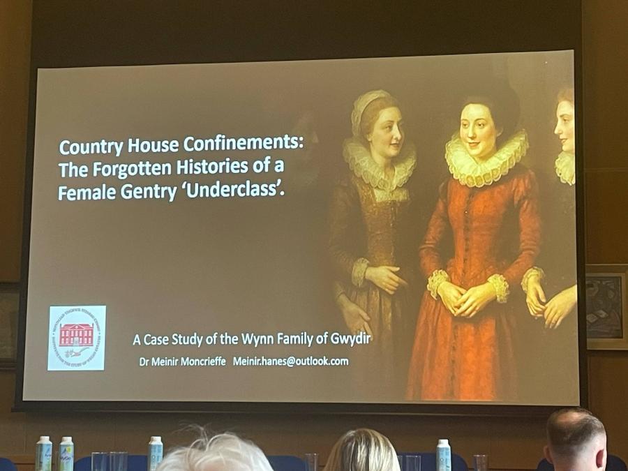 A powerpoint presentation with the title of Meinir's talk and a portrait of four early modern gentry women