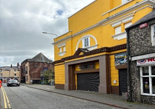 Bright yellow building on High Street 