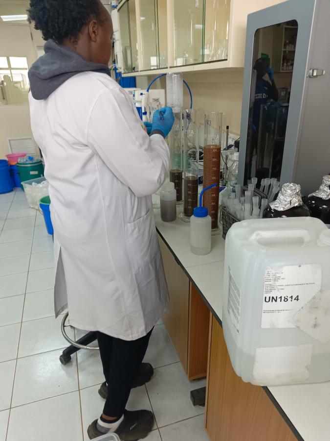 Caroline calibrating the soil pH meter at the Mazingira Centre Soil Laboratory 