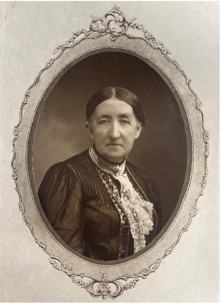 A plate containing a sepia photograph of a woman. 